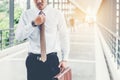 Businessman holding trolley bag going up on travel Royalty Free Stock Photo