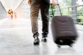 Businessman holding trolley bag going up on travel Royalty Free Stock Photo