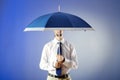 Businessman holding umbrella Royalty Free Stock Photo