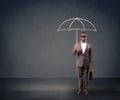 Businessman holding an umbrella.