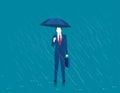 Businessman holding an umbrella. Man standing in rain. Heavy rain, rain, storm. Modern man a stylish suit with elegant umbrella. Royalty Free Stock Photo