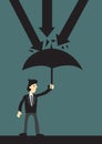Businessman holding an umbrella protecting himself from danger. Concept of security, business and economic protection