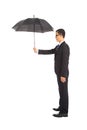 Businessman holding umbrella standing Royalty Free Stock Photo