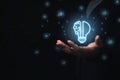 Businessman holding virtual light bulb and half brain on blue bokeh background smart thinking concept and innovative ideas