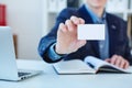 Businessman holding visit card close-up. Man showing blank business card. Person in blue suit. Mock up design. Royalty Free Stock Photo