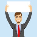 Businessman holding white blank board Royalty Free Stock Photo