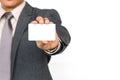 A businessman holding a white blank business name card