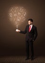 Businessman holding a white cup with social media icons Royalty Free Stock Photo