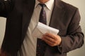 Man holds an envelopes Royalty Free Stock Photo