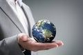 Businessman holding the world in his hands Royalty Free Stock Photo