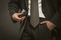Businessman holds big luxury wallet. Close up of male hand holding black leather wallet with credit cards and cash Royalty Free Stock Photo