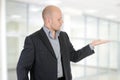 Businessman holds his hand palm up. Royalty Free Stock Photo