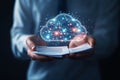 businessman holds open book with glowing cloud technology icon above it symbolizing digital innovation and knowledge sharing Royalty Free Stock Photo