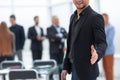 Businessman holds out his hand for a handshake Royalty Free Stock Photo