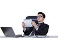 Businessman holds tablet and lean on office chair Royalty Free Stock Photo