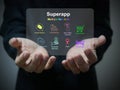 A businessman holds a virtual screen of superapp that serves multiple services as a one stop service Royalty Free Stock Photo