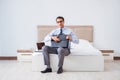 The businessman in the hotel room during travel Royalty Free Stock Photo