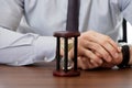 Businessman with hourglass in the office. Royalty Free Stock Photo