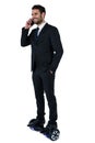 Businessman on hoverboard talking on mobile phone Royalty Free Stock Photo