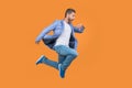 Businessman hurry being late. Shocked late businessman checking time in midair. late businessman Royalty Free Stock Photo