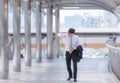 Businessman in a hurry checking time and running, he is late for work his business appointment. Royalty Free Stock Photo