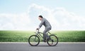 Businessman hurry to work by bike Royalty Free Stock Photo