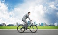 Businessman hurry to work by bike Royalty Free Stock Photo