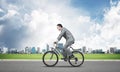 Businessman hurry to work by bike Royalty Free Stock Photo