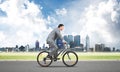 Businessman hurry to work by bike