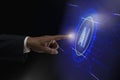 Businessman index finger about to touching AI Artificial intelligence icon on a virtual screen. Representing machine learning and Royalty Free Stock Photo