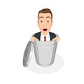 Businessman inside a trash can