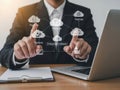 Businessman interacting with cloud computing interface on laptop, representing modern technology and innovation Royalty Free Stock Photo
