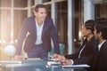 Businessman interacting with coworkers in a meeting in the conference room Royalty Free Stock Photo