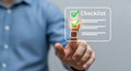 Businessman Interacting with Digital Checklist Interface for Task Management Royalty Free Stock Photo