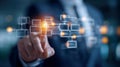 Businessman interacting with digital flowchart interface depicting data connections and organizational processes in a futuristic Royalty Free Stock Photo