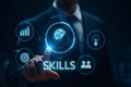Businessman interacting with digital interface displaying skills and career development icons Royalty Free Stock Photo