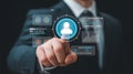 Businessman interacting with a digital interface displaying user profile and data analytics Royalty Free Stock Photo