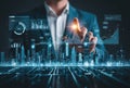 Businessman interacting with futuristic cityscape and data visualization interface Royalty Free Stock Photo