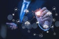 Businessman interacting with a futuristic digital interface featuring AI, cloud computing, and global network icons Royalty Free Stock Photo