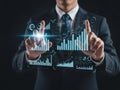 Businessman interacting with virtual data visualization interface for business analysis Royalty Free Stock Photo