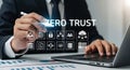 Businessman interacting with Zero Trust concept and cybersecurity icons on a virtual screen Royalty Free Stock Photo