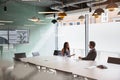 Businessman Interviewing Female Candidate At Graduate Recruitment Assessment Day In Office