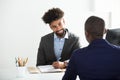 Businessman Interviewing Male Candidate