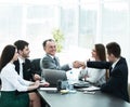 Businessman and investor shake hands at the negotiating table Royalty Free Stock Photo