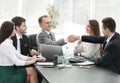 Businessman and investor shake hands at the negotiating table Royalty Free Stock Photo
