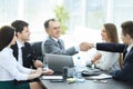 Businessman and investor shake hands at the negotiating table Royalty Free Stock Photo