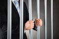 Businessman in jail Royalty Free Stock Photo