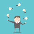 Businessman juggling light bulbs Royalty Free Stock Photo