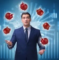 Businessman juggling with piggybanks in business concept Royalty Free Stock Photo