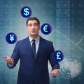 Businessman juggling between various currencies Royalty Free Stock Photo